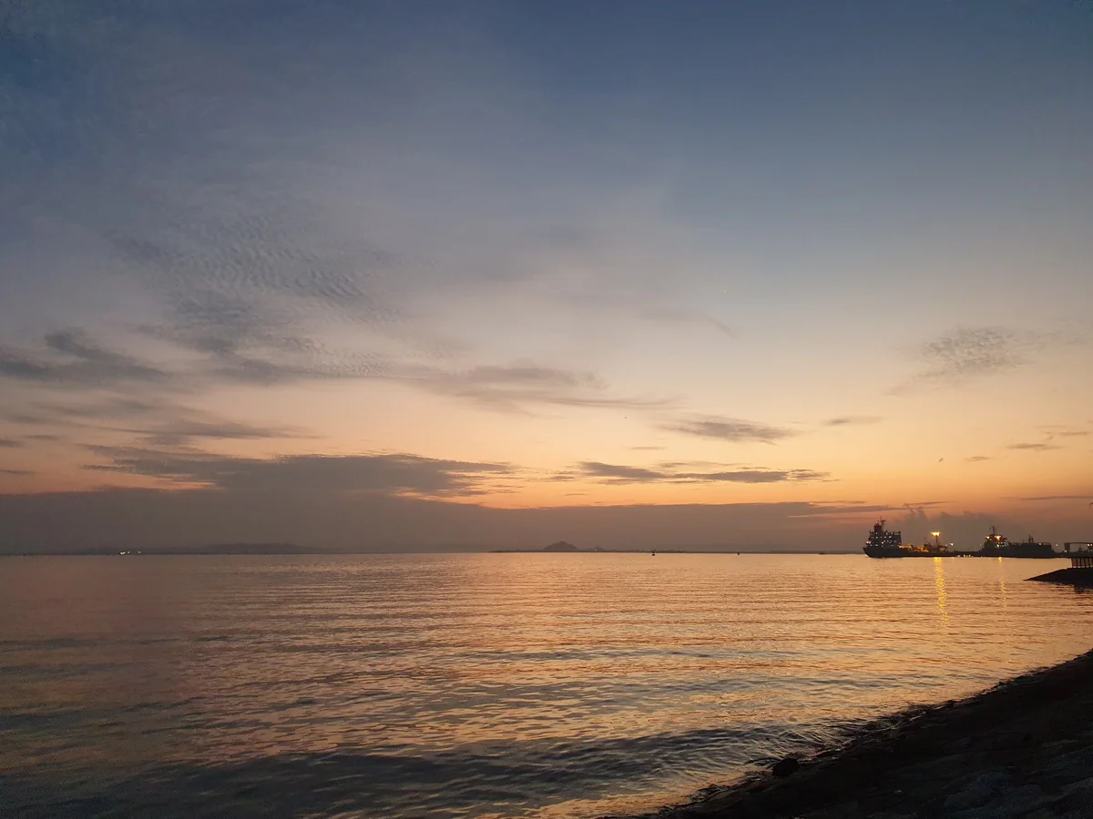 A serene moment at Changi Beach Park before sunrise, providing us with a chance to rest and witness the day's beginning.