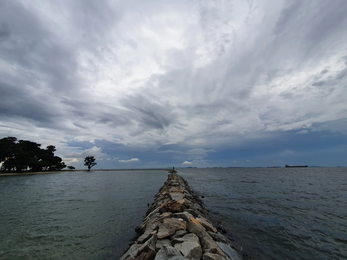 Walking on Kusu rock embankment.